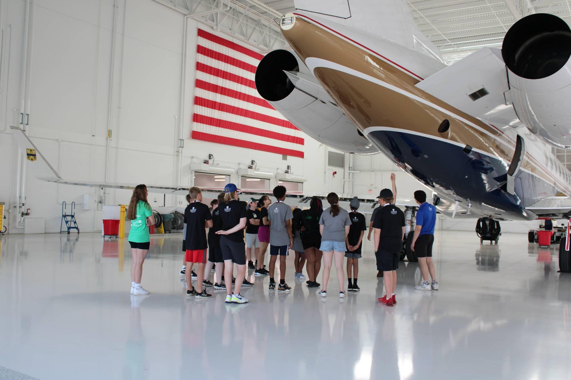 Campers visiting Amway Hangar.